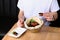 Man eating in restaurant. pizza with mussels on table restaurant traditional pizza with basil leaf