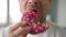 Man eating sweet pink donut. Close-up