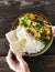 Man eats cauliflower spicy curry rice naan bread top view