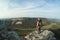 Man on the edge of a cliff in cave town Mangup-Kale