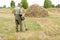 Man with electronic metal detector device working on outdoors