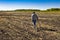 Man with electronic metal detector device working on outdoors background. Close-up photography of searching process