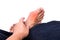 Man embraces foot with painful and swollen gout inflammation