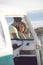 Man embracing woman near camper van at beach