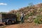 Man emptying garden waste at city dump