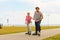 Man encourage woman to do rollerblading