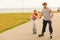 Man encourage woman to do rollerblading