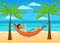 Man enjoying summer time holidays, vacations, lying in hammock under palm trees