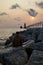 A man enjoying sunset and lighthouse at Grant Heaven Lake Michigan