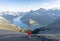 Man enjoying the view on alpine valley and lake after reaching mountain summit in Canadian Rockies,Rimwall Summit,Canada