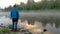 Man enjoys clear lake with morning fog and reflecting sky