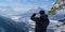 Man enjoys the view and looks down on Garmisch-Partenkirchen and Farchant