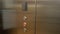 Man enters the elevator, then attach his plastic key card in elevator in order to unlock ability to enter his floor