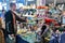 Man examines a display table of all kinds of crystals and gemstones