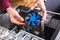 Man examines laptop PC clean dust pollution