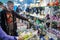 Man examining a colorful display of minerals and crystals