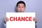 A man with excited face showing CHANCE sign