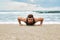 Man Exercising, Doing Push Up Exercises On Beach. Fitness Workout