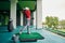 Man exercising on the golf hitting mat