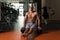 Man Exercising Handstand Push-Ups On Ball In Gym