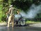 Man extinguishing fire on motorbike