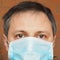 Man with facemask to stop spreading infection of respiratory ill