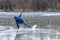 Man falling down while ice skating. Snow skates from the scatter in the parties