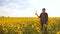 Man farmer hand hold bottle of sunflower oil the field at sunset. slow motion video. man farmer agriculture plastic