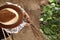 Man farmer working in vegetable garden with bamboo sticks for ti