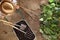 Man farmer working in vegetable garden, wheelbarrow full of fertilizer with spade and pitchfork, bamboo sticks for tie the plants