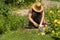 Man is farming, planting in his beautiful garden.