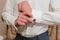 A man fastens a cufflink on his shirt. Groom fastening cufflinks on his shirt