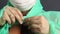 A man fastens a protective coat with buttons. Close-up shot. Virus protection