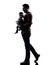 Man father walking with baby silhouette