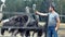 Man feeding ostriches at the zoo.