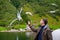 Man feeding seagulls flying over the ferry boat