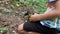 A man feeds nuts to a squirrel. Forest rodent prepares stocks for the winter.