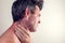 Man feels neck pain. People, healthcare and medicine concept
