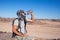 Man feels thirst and drinks water in the desert