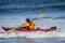 Man fighting the wave on kayak on rough sea