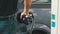 Man filling car with Diesel Fuel. Man`s hand using a petrol pump to fill his car up with fuel.