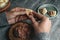 man is filling a Catalan galet with ground meat