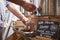 Man Filling Container With Wild Honey In Sustainable Plastic Free Grocery Store