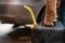 man filling fuel tank of his car with diesel fuel from the jerry can as there is no fuel at the petrol station, close up