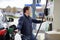 Man filling gasoline fuel in car