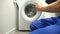 Man filling guarantee document for washing machine, maintenance and repair
