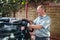 Man filling oil tank with kerosene at a home in England, UK