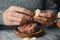 Man filling some Catalan galets with ground meat