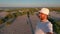 A man films himself against the backdrop of the Kinburn Spit landscape early in the morning