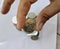 A man finger holding a Indonesian Coin